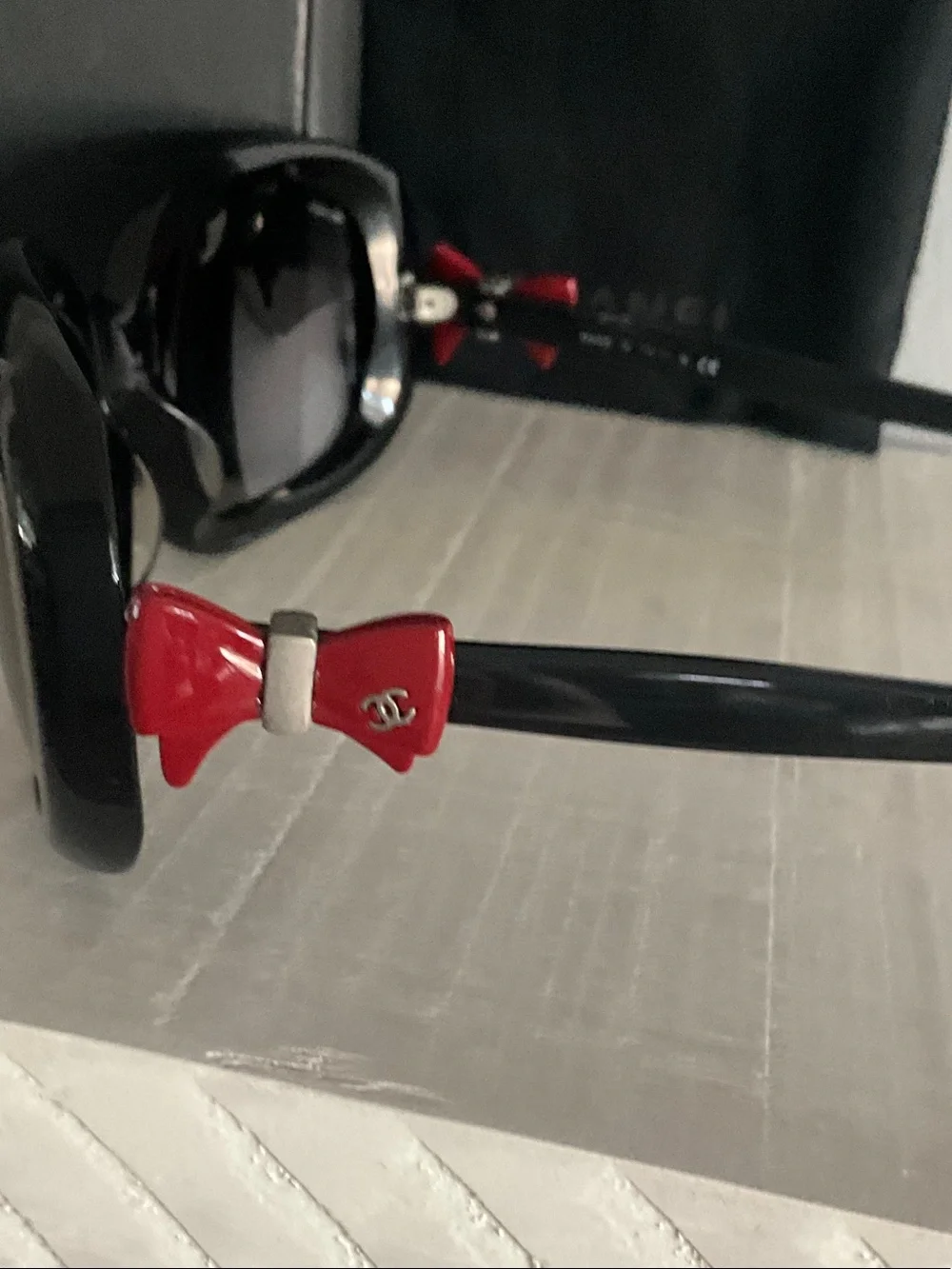 CHANEL Black Sunglasses with Red Accents and Gradient Lenses